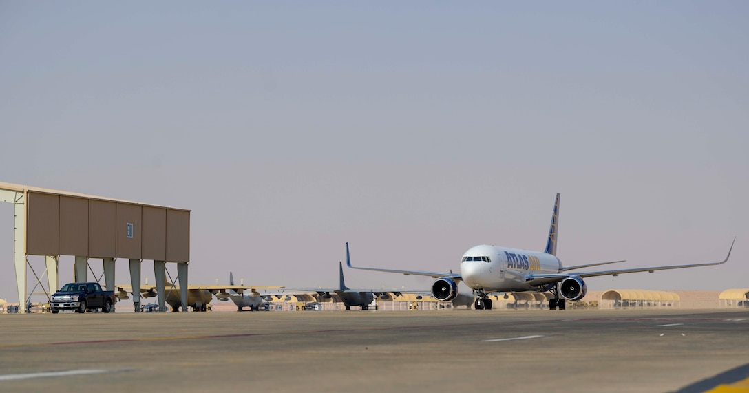 An aircraft carrying members of the District of Columbia Air National Guard’s 113th Wing, known as the “Capital Guardians,” taxis on the flight line upon arrival at Prince Sultan Air Base, Kingdom of Saudi Arabia, July 11, 2021. The wing deployed a contingent of U.S. Air Force F-16 Fighting Falcons to PSAB to reinforce the base’s defensive capabilities, provide operational depth, and support U.S. Central Command operations in the region. (U.S. Air Force Photo by Senior Airman Samuel Earick)