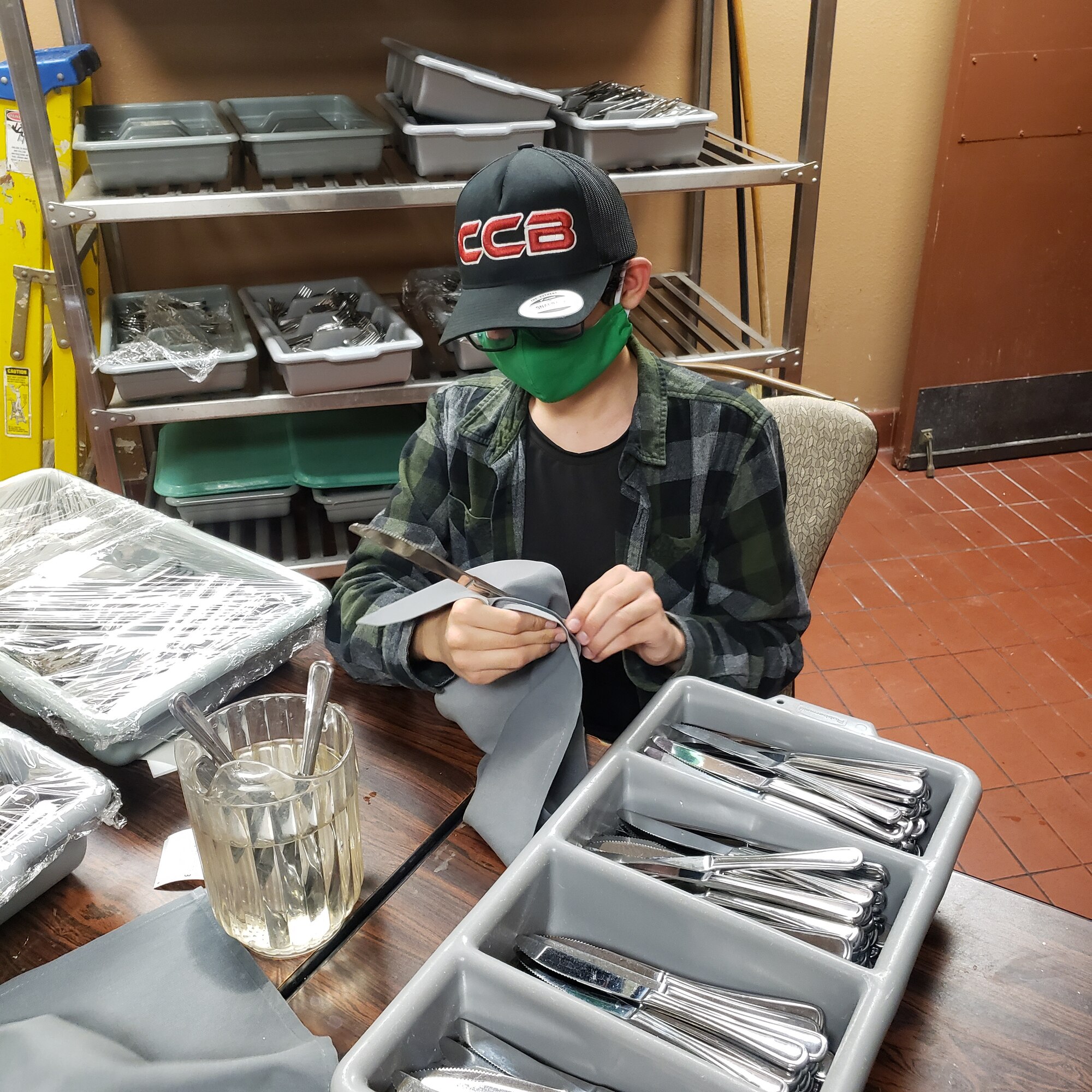 Jason Contreras, Project SEARCH intern, prepares cutlery at Club Five Six, Nov. 19, 2020, at Luke Air Force Base, Arizona. Project SEARCH offers high school graduates with significant disabilities, ranging from ages 18-26, internship opportunities centered on professional development, personal growth and technical skill enhancement to increase their probability of securing meaningful and competitive employment following completion of the program. Luke AFB has partnered with Project SEARCH for the past three years allowing interns to work side-by-side with U.S. Air Force personnel to build upon their skill sets, which aids the 56th Fighter Wing’s efforts of bolstering partnerships with the local community. (Courtesy photo)