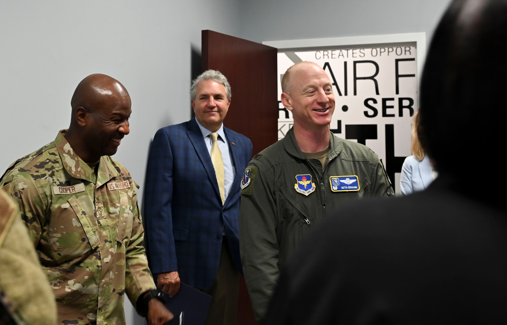 U.S. Air Force Col. Seth Graham (Right), 14th Flying Training Wing commander, and Chief Master Sgt. Antonio Cooper (Left), 14FTW command chief, share a laugh during a briefing tour of the  new Welcome Center, July 20, 2021, on Columbus Air Force Base, Miss. The Welcome Center was inspired by the Air Force True North Program, which seeks to help improve the well-being of Airmen and their families. (U.S. Air Force photo by Airman 1st Class Jessica Haynie)