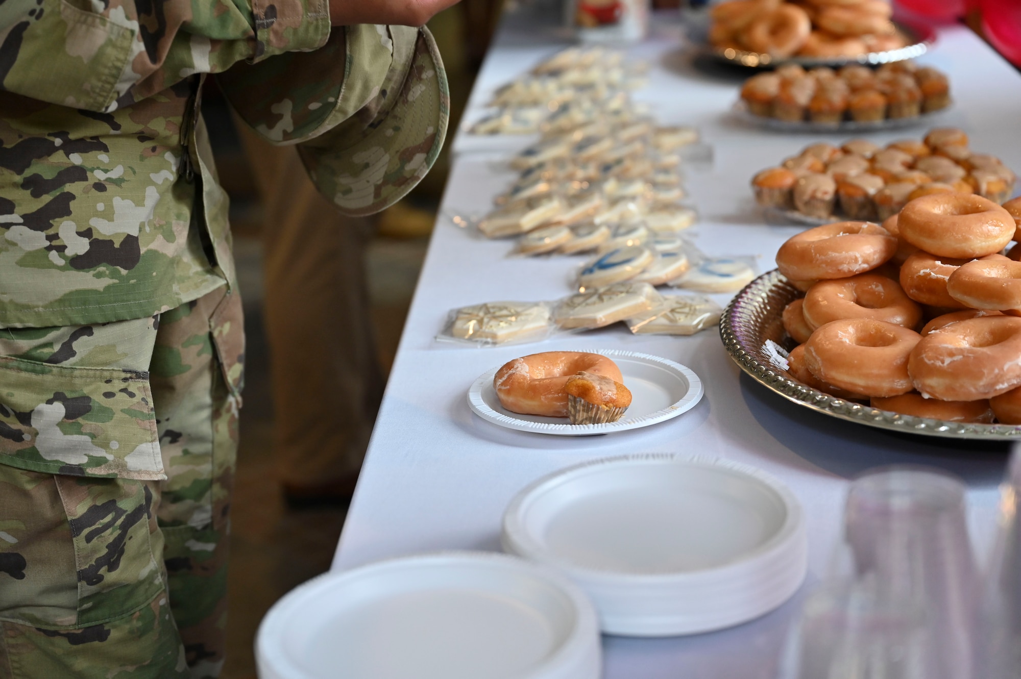 Refreshments including donuts and cookies were offered to attendees for the grand opening of the 14th Flying Training Wings very first Welcome Center, July 20, 2021, on Columbus Air Force Base, Miss. The Welcome Center will help mitigate the frustrations incoming Airmen may feel while completing their in-processing checklist by brining all agencies needed to complete in-processing to one central location. (U.S. Air Force photo by Airman 1st Class Jessica Haynie)