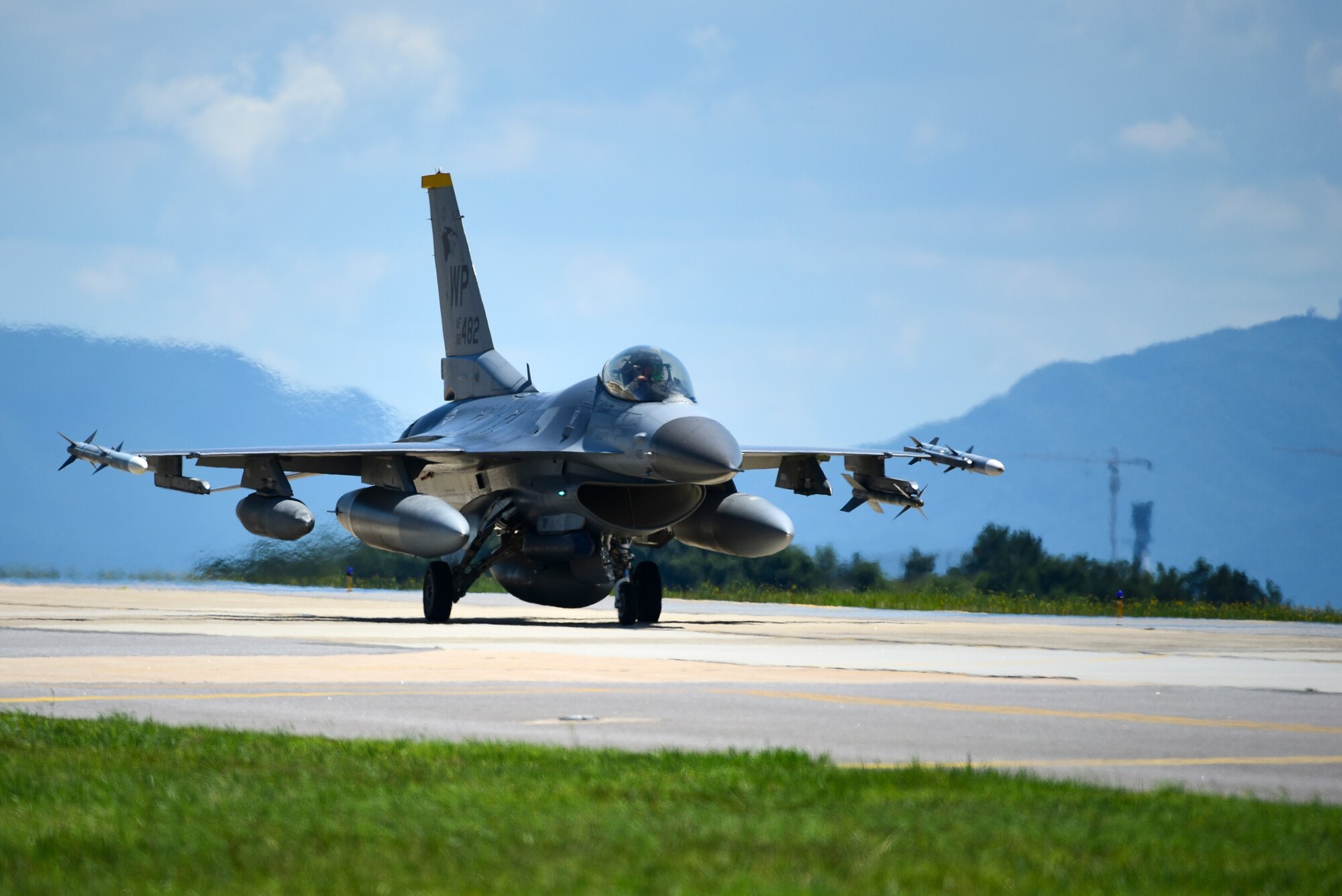 An F-16 Fighting Falcon taxis at Kunsan Air Base, Republic of Korea, July 16, 2021. The last of the 8th Fighter Wing jets returned home after supporting a month-long multinational training event at Red Flag-Alaska 21-2, while practicing Agile Combat Employment tactics. (U.S. Air Force photo by Senior Airman Suzie Plotnikov)