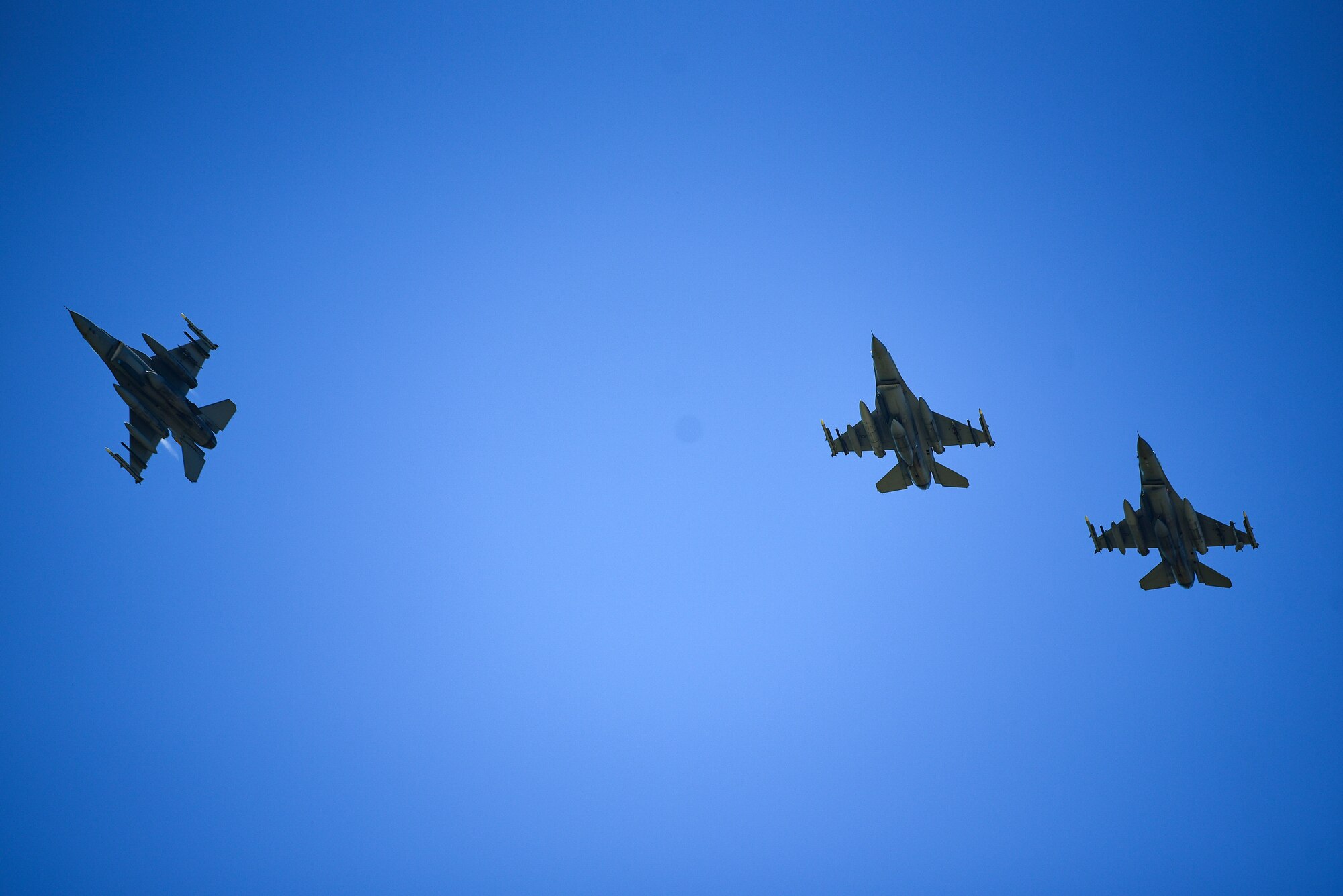 Three F-16 Fighting Falcons fly in formation above Kunsan Air Base, Republic of Korea, July 15, 2021.The last of the 8th Fighter Wing jets returned home after supporting a month-long multinational training event at Red Flag-Alaska 21-2, while practicing Agile Combat Employment tactics. (U.S. Air Force photo by Senior Airman Suzie Plotnikov)