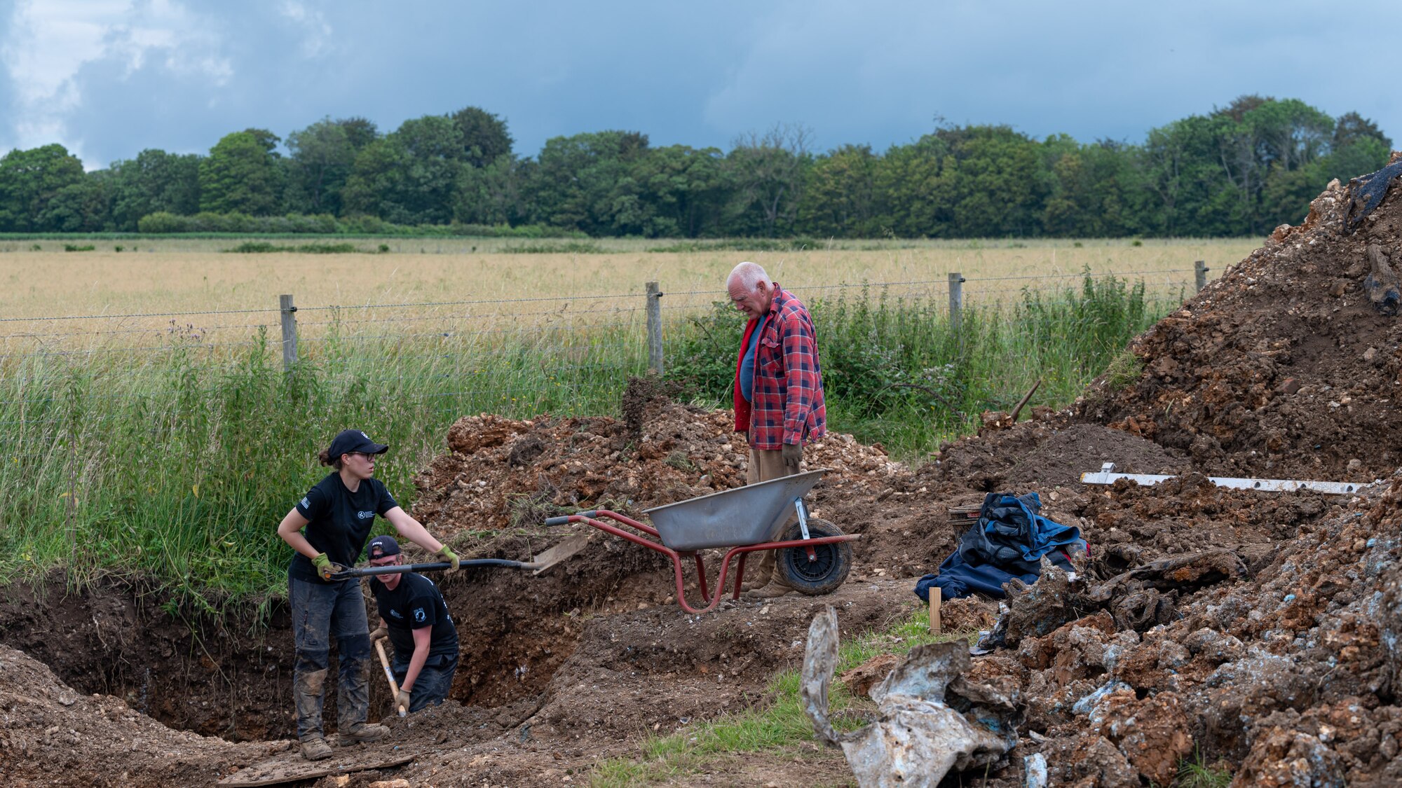 Volunteers with the American Veterans Archeological Recovery group search for remains of fallen service members during a B-24 Liberator excavation at Park Farm in Arundel, England, July 8, 2021. The team was comprised of around 20 volunteers from local universities, veterans from both United States and British armed forces, and active duty service members from RAF Lakenheath. (U.S. Air Force photo by Senior Airman Koby I. Saunders)