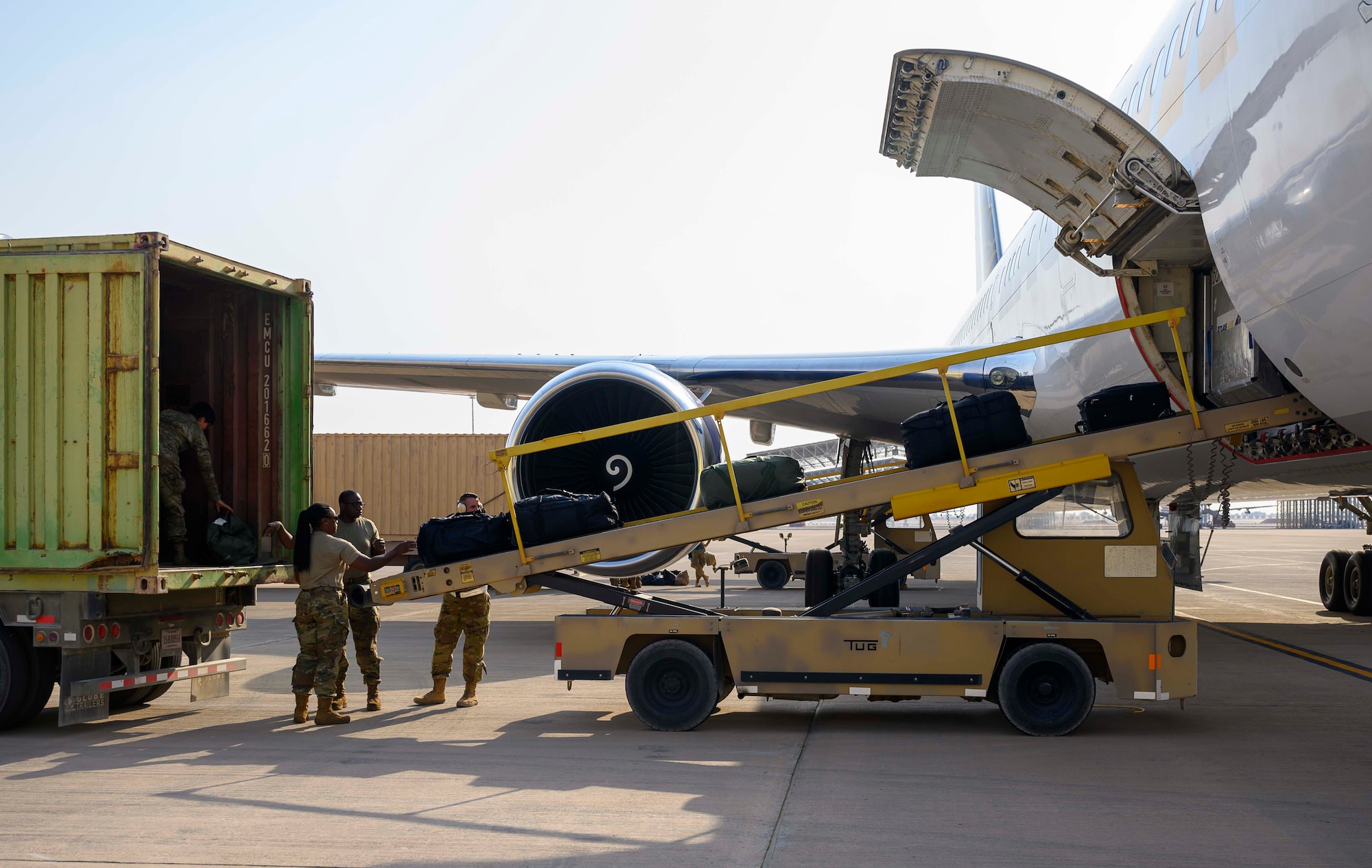 Airmen from the District of Columbia Air National Guard’s 113th Wing, known as the “Capital Guardians,” unload luggage after arriving at Prince Sultan Air Base, Kingdom of Saudi Arabia, July 11, 2021. The wing deployed a contingent of U.S. Air Force F-16 Fighting Falcons to PSAB to reinforce the base’s defensive capabilities, provide operational depth, and support U.S. Central Command operations in the region. (U.S. Air Force Photo by Senior Airman Samuel Earick)