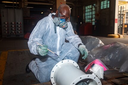 Norfolk Naval Shipyard's John Horton performing his tasks.