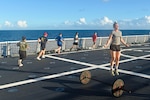 Members of the U.S. Coast Guard Cutter Stone conduct a regular workout while at sea in the South Atlantic on Jan. 19, 2021. Maintaining physical fitness is key to performing operations safely. (U.S. Coast Guard photo by Petty Officer 3rd Class John Hightower)