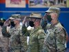 The official party consisting of the outgoing Area Support Group - Kuwait commander, U.S. Army Col. John J. Herrman, Deputy Commanding Officer - Operations for U.S. Army Central, Australia Maj. Gen. Brian Field, and incoming ASG-KU commander, Col. Charles S. Lockwood salute the colors during a change of command ceremony at Camp Arifjan, July 12, 2021. ASG-KU implements the Defense Cooperation Agreement on behalf of USARCENT with the Kuwait Ministry of Defense and supports USARCENT in providing safe, secure base camps for tenant and rotational forces. (U.S. Army photo by Staff Sgt. True Thao)