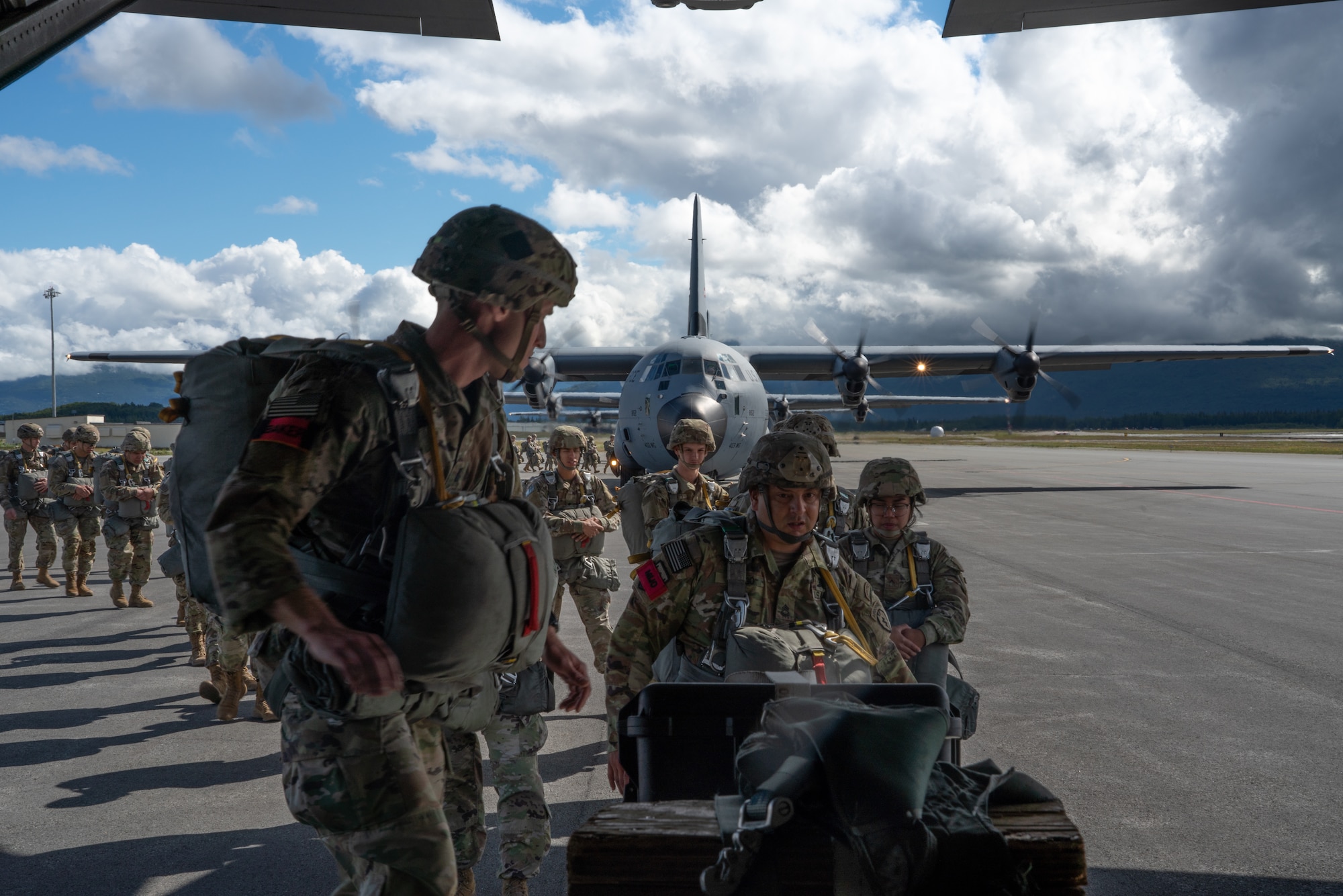 U.S. Army troops from the 4th Brigade Combat Team (Airborne), 25th Infantry Division trained with 815th Airlift Squadron Reserve Citizen Airmen during a training exercise at Joint Base Elmendorf-Richardson, Alaska July 13-16, 2021. The 815th AS provided airlift for more than 1300 paratroopers. (U.S. Air Force photo by Staff Sgt. Shelton Sherrill)