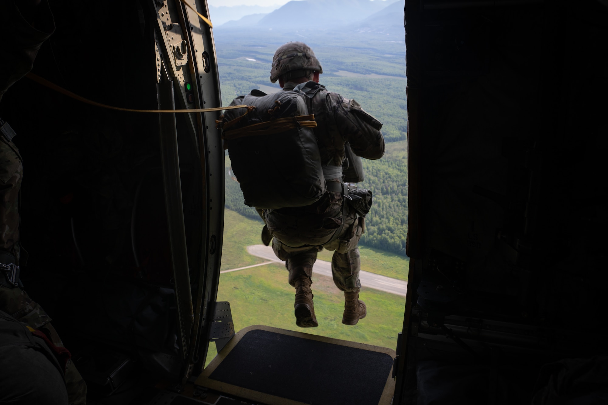 U.S. Army troops from the 4th Brigade Combat Team (Airborne), 25th Infantry Division trained with 815th Airlift Squadron Reserve Citizen Airmen during a training exercise at Joint Base Elmendorf-Richardson, Alaska July 13-16, 2021. The 815th AS provided airlift for more than 1300 paratroopers. (U.S. Air Force photo by Staff Sgt. Shelton Sherrill)