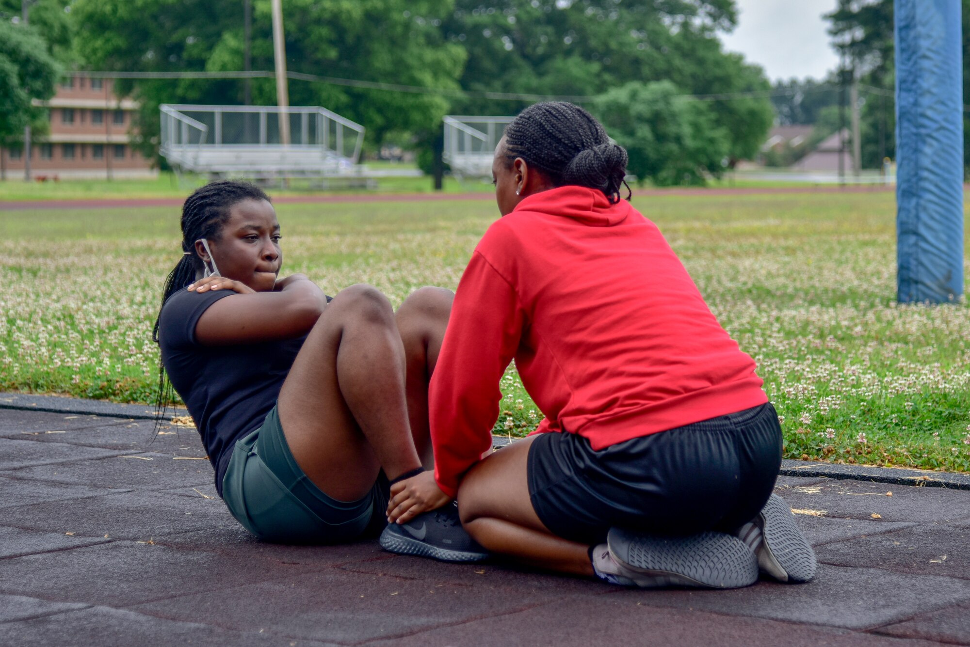 Akorfa Domey, a trainee in the 913th Airlift Group’s Development and Training Flight, is tested on her sit ups during the Physical Training portion of the drill weekend. Domey decided to join the Air Force Reserve after she and her family moved to Arkansas from Ghana two years ago. (U.S. Air Force Photo by Senior Airman Kalee Sexton)