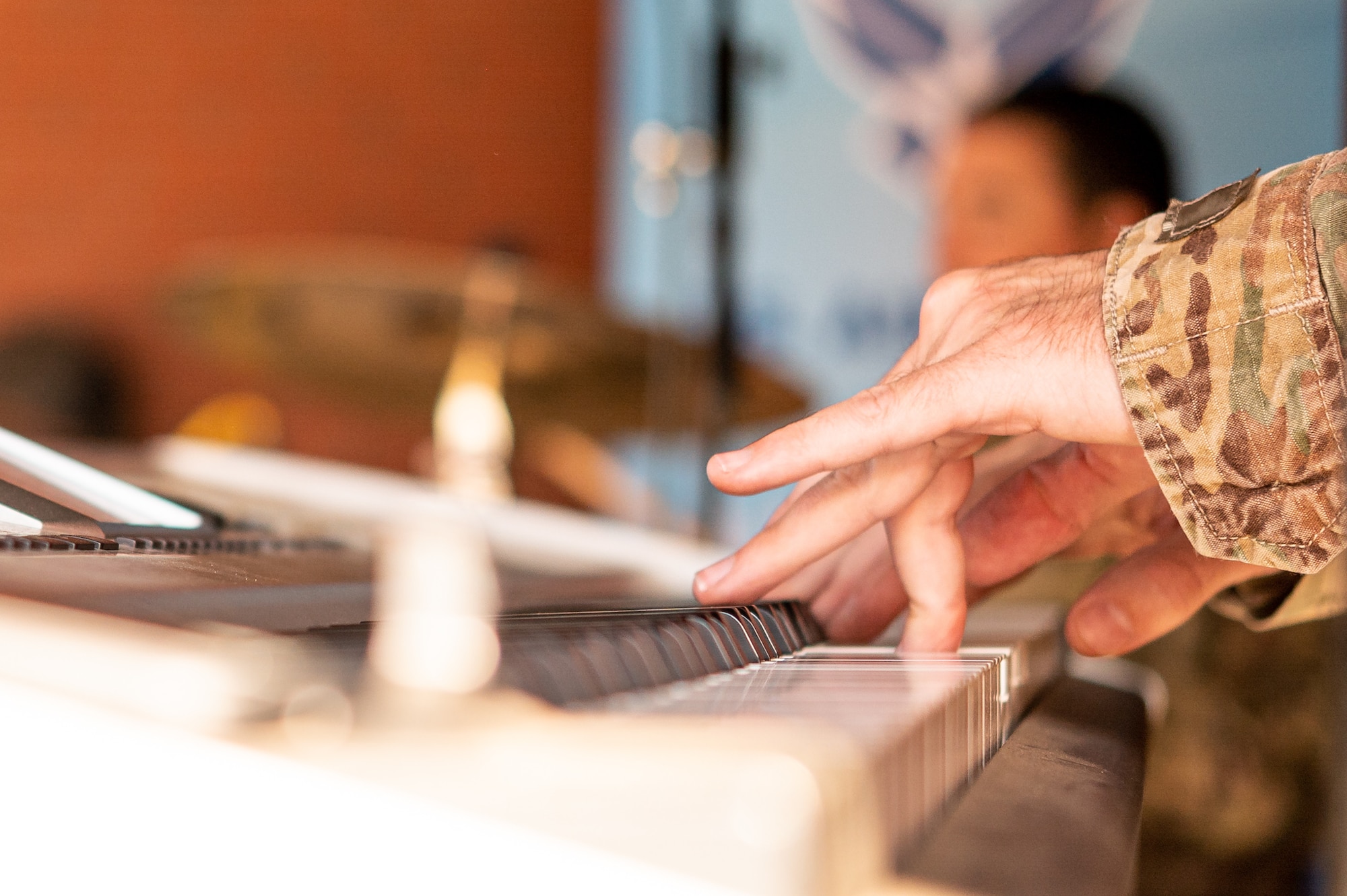 U.S. Air Force Tech. Sgt. Ryan Rager, USAF Band of Mid-America musician, plays the piano before a baseball game at Busch Stadium on St. Louis, Missouri, July 16, 2021. The USAF Band of Mid-America has a group of seven Airmen who make up Starlifter, which perform a wide range of musical styles including rock, pop, jazz and country, as well as traditional patriotic songs. (U.S. Air Force Photo by Airman 1st Class Isaac Olivera)