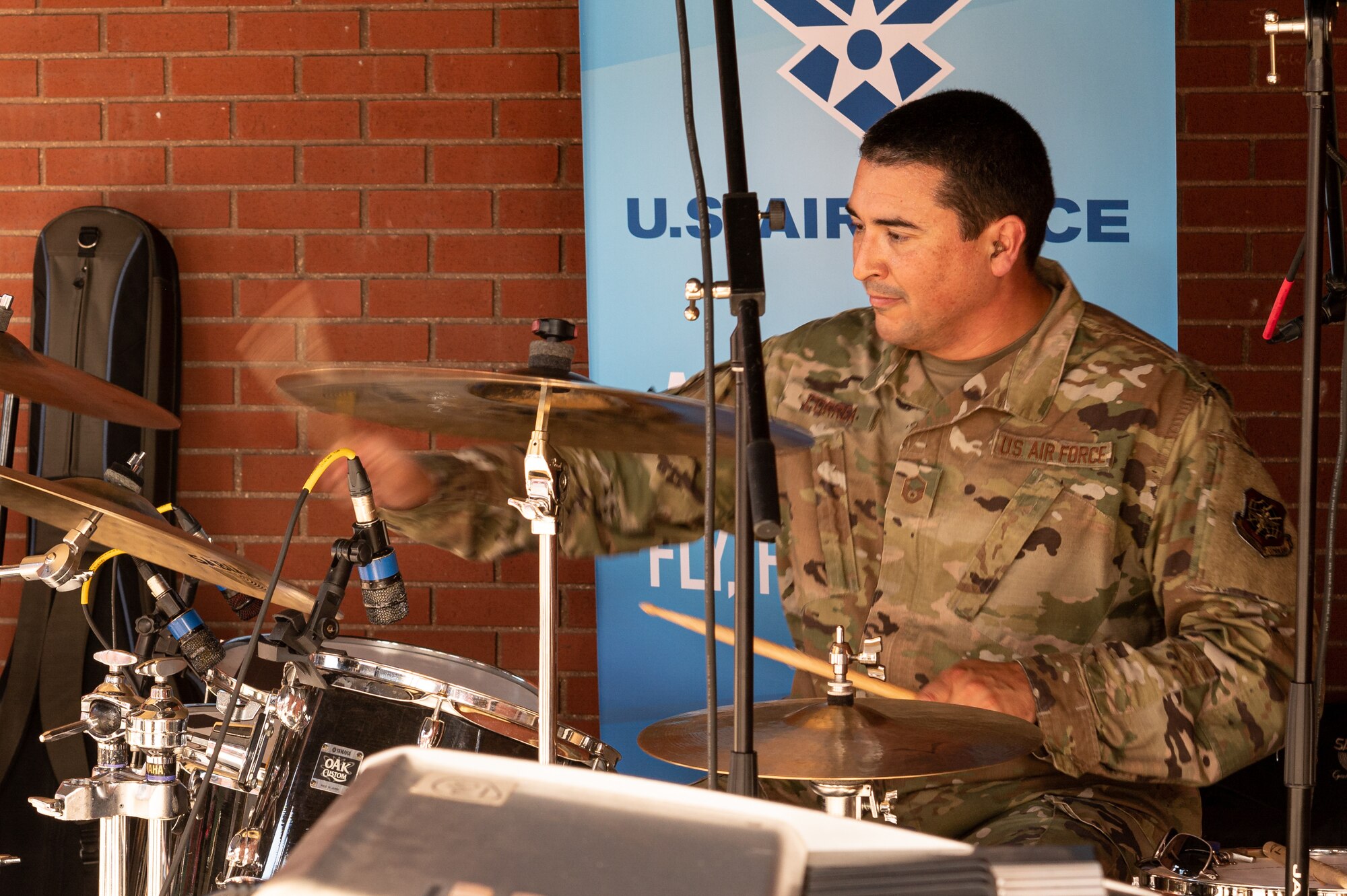 U.S. Air Force Master Sgt. Mike Correa, USAF Band of Mid-America musician, plays the drums before a baseball game at Busch Stadium on St. Louis, Missouri, July 16, 2021. This performance was Correa’s last as a member of the USAF Band of Mid-America. (U.S. Air Force Photo by Airman 1st Class Isaac Olivera)