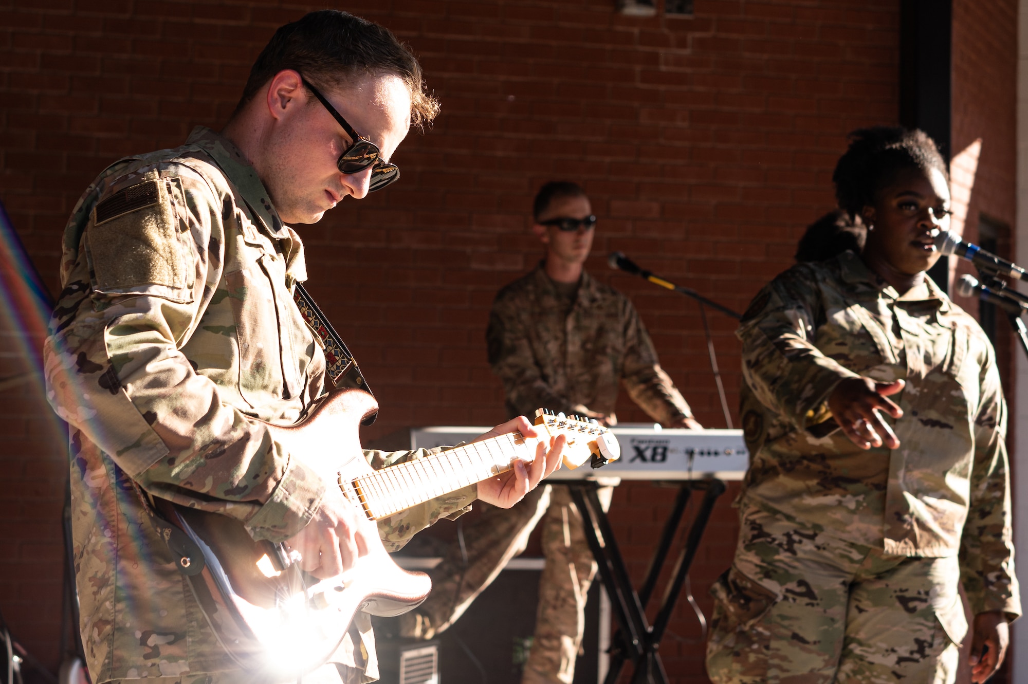 U.S. Air Force Senior Airman Josiah Joyce, USAF Band of Mid-America musician, plays the guitar before a baseball game at Busch Stadium on St. Louis, Missouri, July 16, 2021. The USAF Band of Mid-America was established in 1942 at Jefferson Barracks, Missouri, but began working in its present base at Scott Air Force Base, Illinois in 1960. (U.S. Air Force Photo by Airman 1st Class Isaac Olivera)