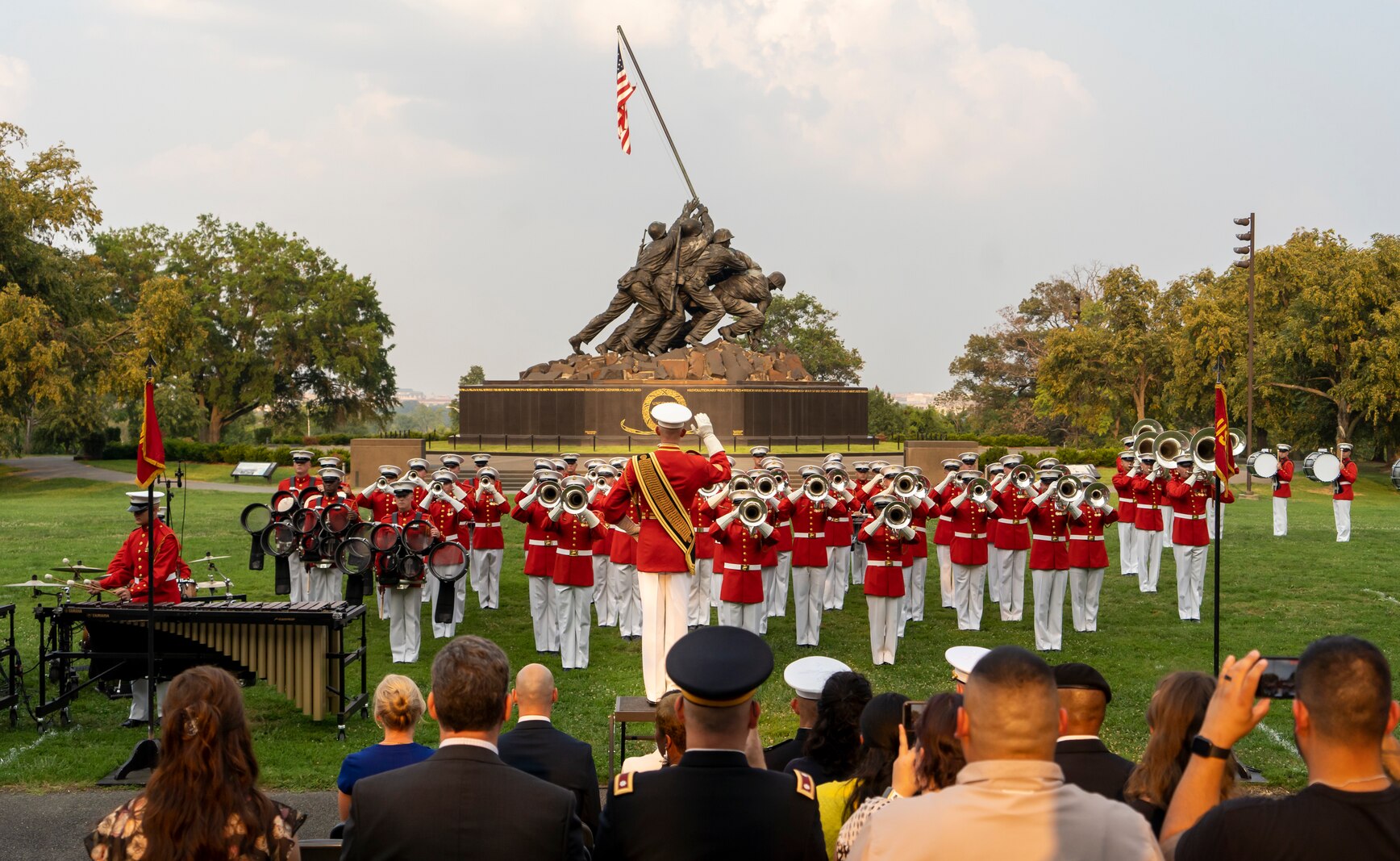 Master GySgt. Keith Martinez, drum major, “The Commandant’s Own,” U.S. Marine Drum and Bugle Corps, conducts the Marines during a Tuesday Sunset Parade at the Marine Corps War Memorial, Arlington, VA, June 15 2021.