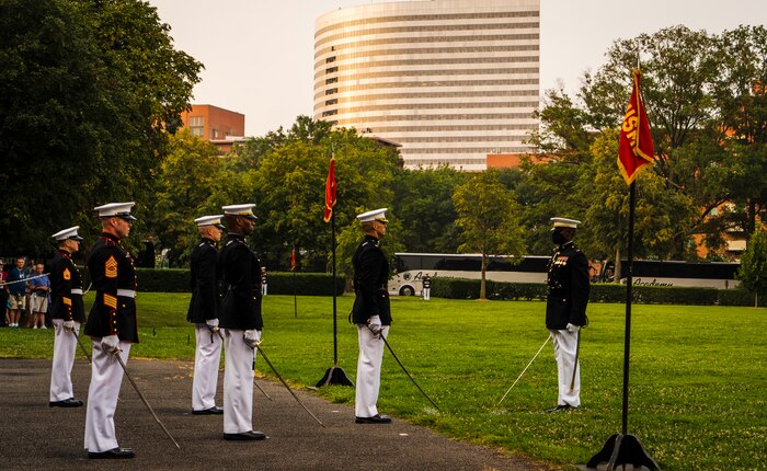 Captain Isaac Seals, the U.S. Marine Corps Silent Drill Platoon, Platoon Commander, salutes the parade staff during a Tuesday Sunset Parade at the Marine Corps War Memorial, Arlington, VA, June 15 2021.