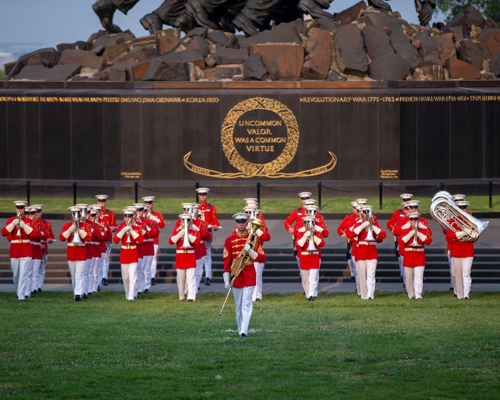 Marines of “The Commandants Own,” U.S. Marine Drum and Bugle Corps, march on to the parade deck during a Tuesday Sunset Parade at the Marine Corps War Memorial, Arlington, VA, June 15 2021.