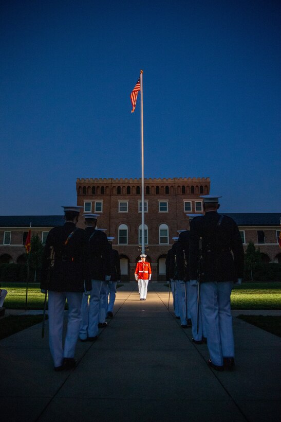 Marines with Marine Barracks Washington conduct “Sound Officer’s Call” during the Friday Evening Parade at Marine Barracks Washington, July 16, 2021.