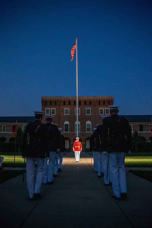Marines with Marine Barracks Washington conduct “Sound Officer’s Call” during the Friday Evening Parade at Marine Barracks Washington, July 16, 2021. The hosting official for the evening was Gen. Gary L. Thomas, the Assistant Commandant of the Marine Corps, and the Guest of Honor was Major General Andrew Freeman AM, Head of Australian Defence Staff.