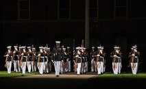 The U.S. Marine Corps Silent Drill Platoon begins their sequence during the Friday Evening Parade at Marine Barracks Washington, July 16, 2021.