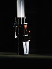 A Barracks Marine strikes the bell signaling the beginning of the Friday Evening Parade at Marine Barracks Washington, July 16, 2021.