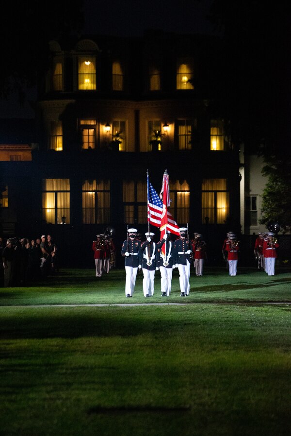 The Official Color Guard of the Marine Corps marches on during the Friday Evening Parade at Marine Barracks Washington, July 16, 2021. The hosting official for the evening was Gen. Gary L. Thomas, the Assistant Commandant of the Marine Corps, and the Guest of Honor was Major General Andrew Freeman AM, Head of Australian Defence Staff.