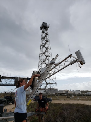 Researchers from the U.S. Army Engineer Research and Development Center's Coastal and Hydraulics Laboratory’s Field Research Facility position equipment along the shore in Duck, North Carolina, in preparation of the During Nearshore Event Experiment beginning fall 2021 along the Outer Banks.