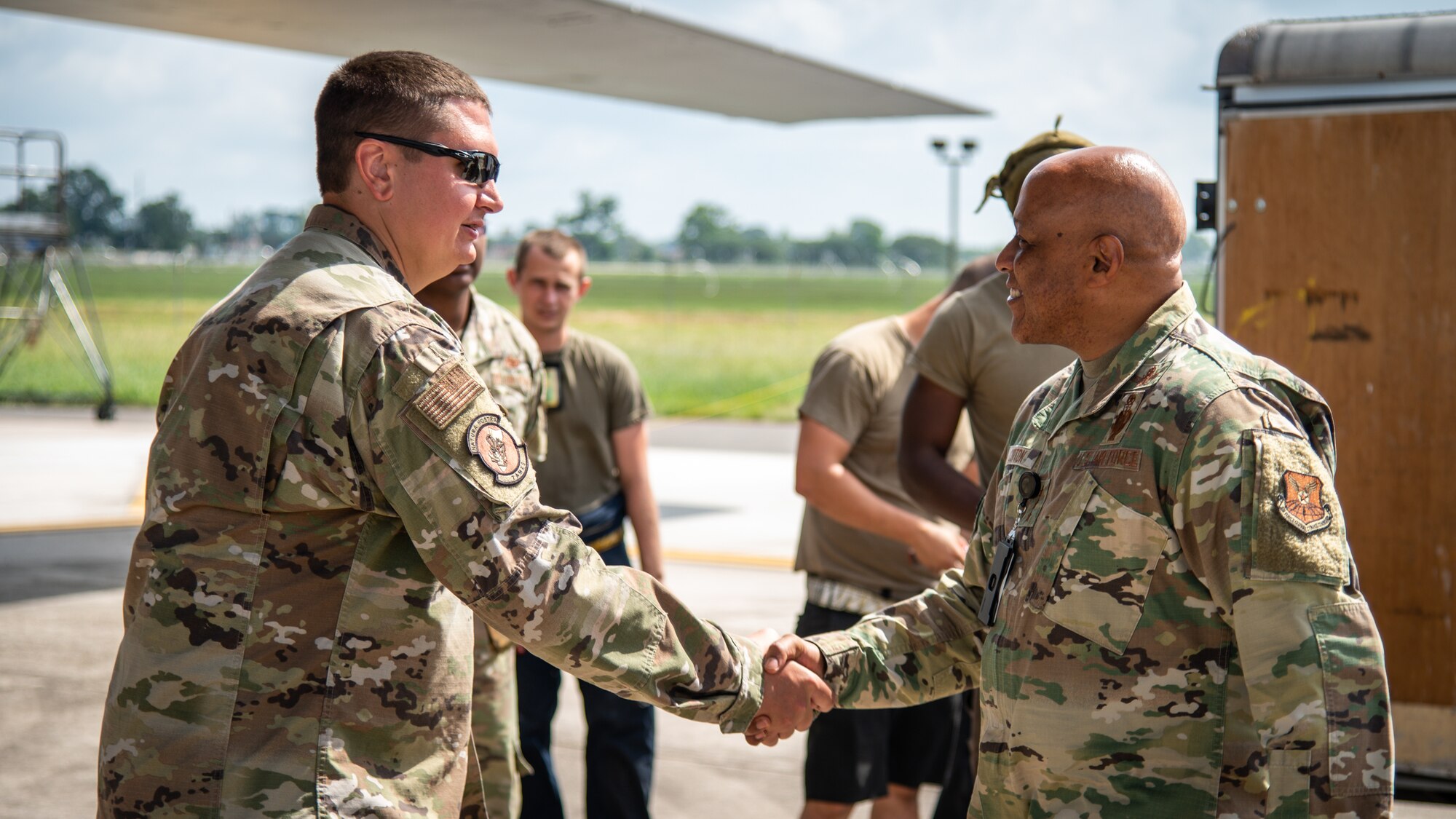 Lt. Gen. Anthony Cotton, Air Force Global Strike Command deputy commander, right, greets Master Sgt. Joshua Gallagher, 9th Aircraft Maintenance Unit production superintendent, left, before touring a B-1B Lancer at Barksdale Air Force Base, Louisiana, July 16, 2021.