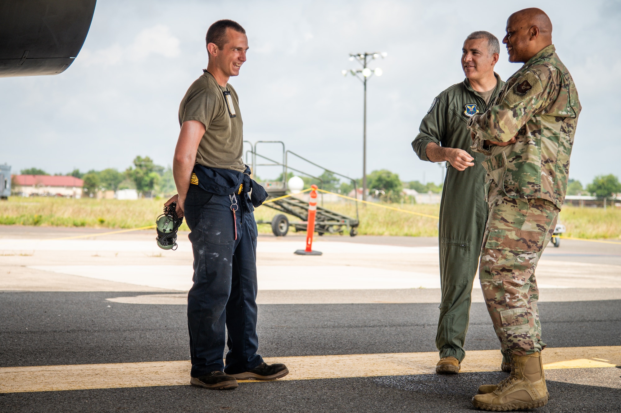 Lt. Gen. Anthony Cotton, Air Force Global Strike Command deputy commander, converses with Airmen from Dyess Air Force Base, Texas, regarding a B-1B Lancer at Barksdale Air Force Base, Louisiana, July 16, 2021.