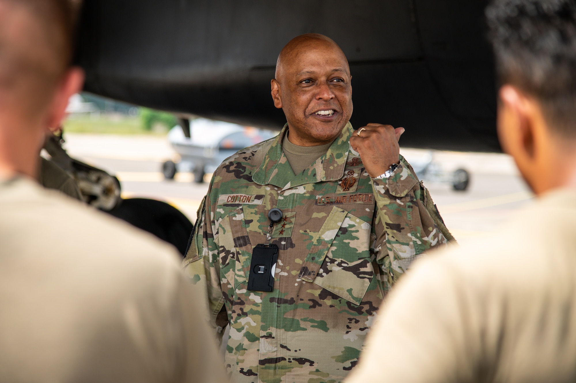 Lt. Gen. Anthony Cotton, Air Force Global Strike Command deputy commander, converses with Airmen from Dyess Air Force Base, Texas regarding a B-1B Lancer at Barksdale Air Force Base, Louisiana, July 16, 2021.