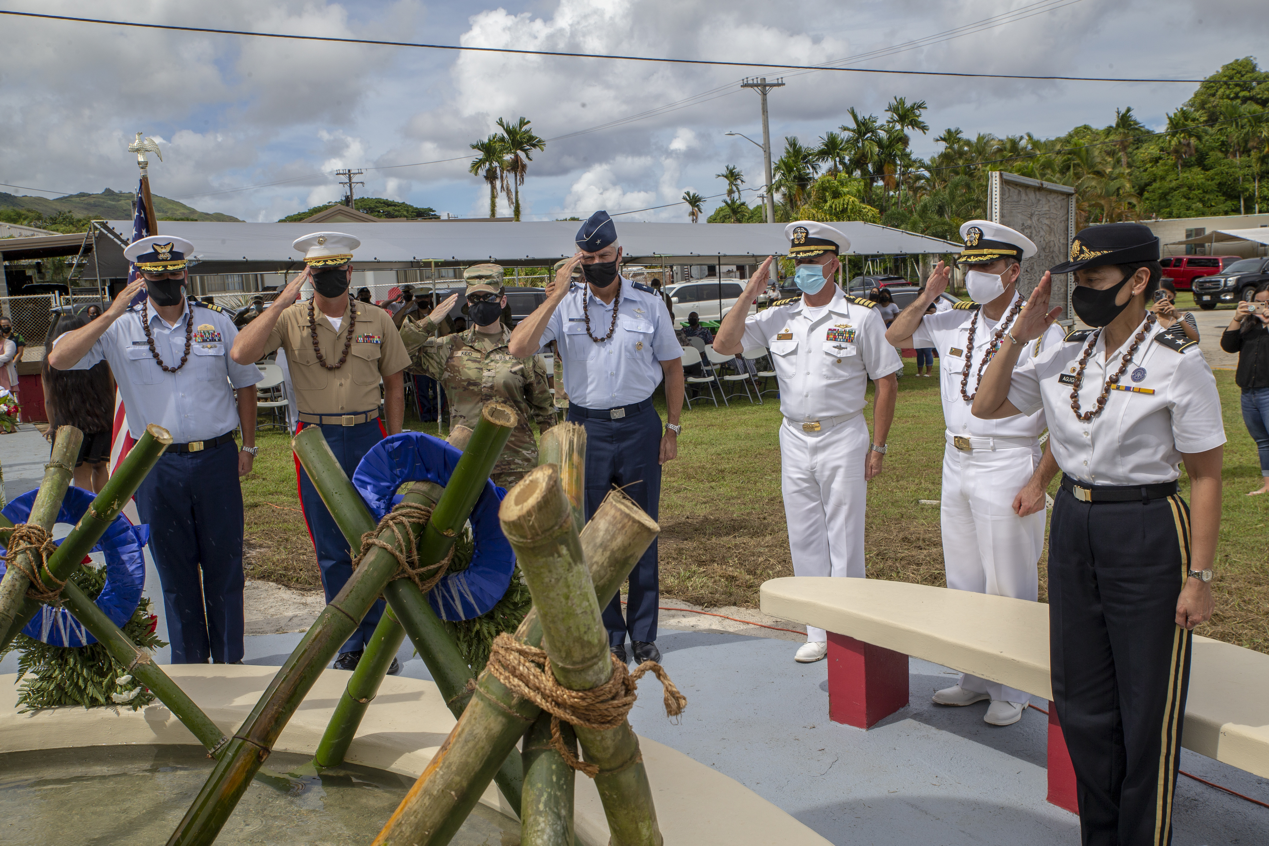 Senior leaders render a salute during a wreath laying ceremony and memorial service at Fena Cave and Hågat Memorial Park in Agat, Guam, July 19, 2021.