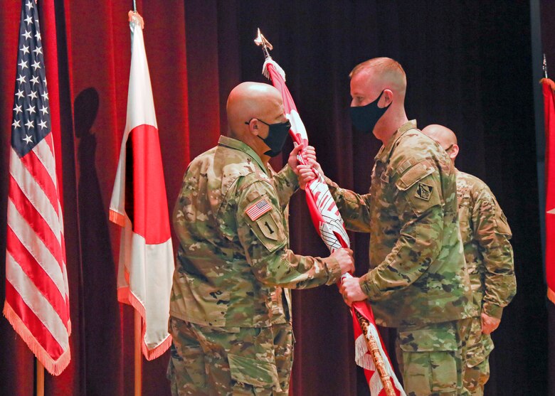 Two Guys Pass a Flag