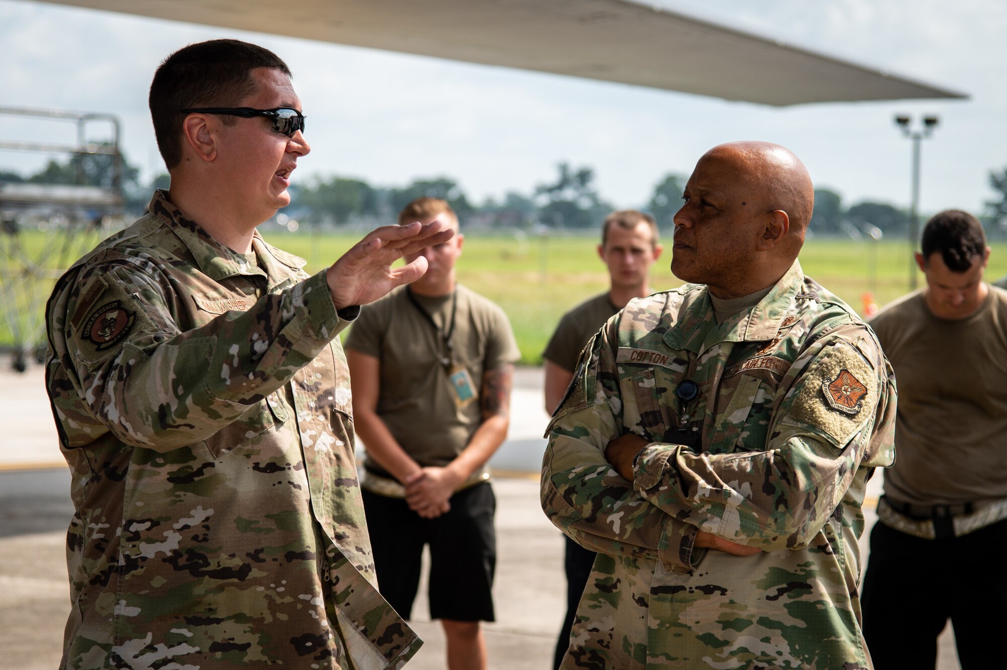 Lt. Gen. Anthony Cotton, Air Force Global Strike Command deputy commander, right, consults Master Sgt. Joshua Gallagher, 9th Aircraft Maintenance Unit production superintendent, left, on the specification of a B-1B Lancer at Barksdale Air Force Base, Louisiana July 16, 2021.
