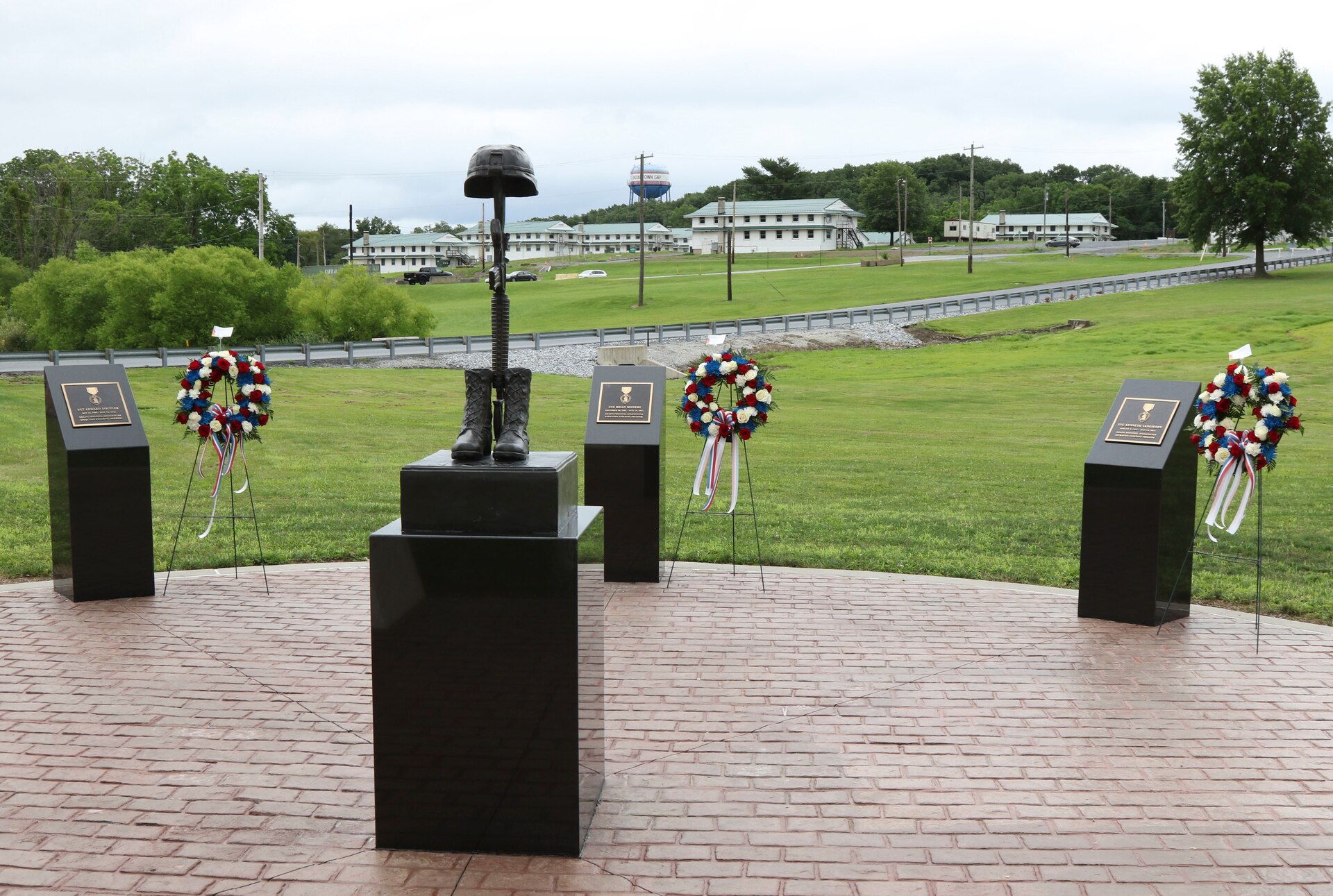 Family, friends and fellow Soldiers of three Pennsylvania National Guardsmen killed in Afghanistan in 2011 gathered at Fort Indiantown Gap to dedicate a memorial in their honor July 18. The dedication took place exactly ten years after the convoy carrying Staff Sgt. Kenneth VanGiesen, Staff Sgt. Brian Mowery, and Sgt. Edward Koehler III, all with the 131st Transportation Company, 213th Regional Support Group, Pennsylvania National Guard, was attacked with an improvised explosive device, killing all three and injuring two others. (U.S. Army National Guard photo by Staff Sgt. Zane Craig)