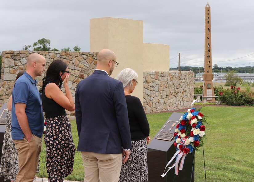 The family of Staff Sgt. Brian Mowery lays a wreath at the portion of the new memorial bearing his name July 18 at Fort Indiantown Gap, part of a ceremony dedicating a memorial in honor of three Soldiers killed in action. The dedication took place exactly ten years after the convoy carrying Mowery, Staff Sgt. Kenneth VanGiesen, and Sgt. Edward Koehler III was attacked with an improvised explosive device, killing all three and injuring two others. (U.S. Army National Guard photo by Staff Sgt. Zane Craig)