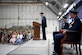 Man speaking at lectern during ceremony