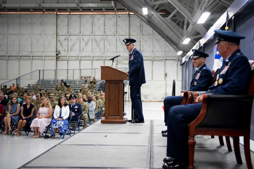 Man speaking at lectern during ceremony