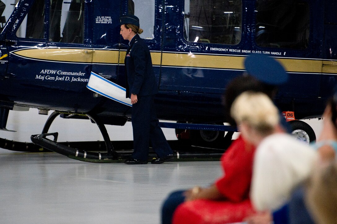 A female airmen reveals name on helicopter