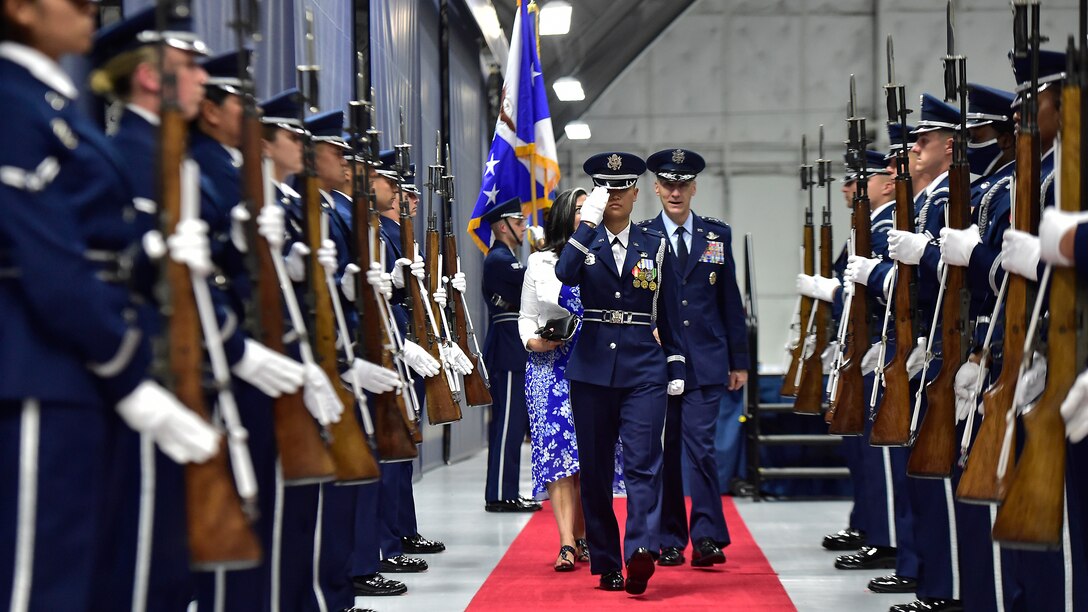 Military member walks down red carpet