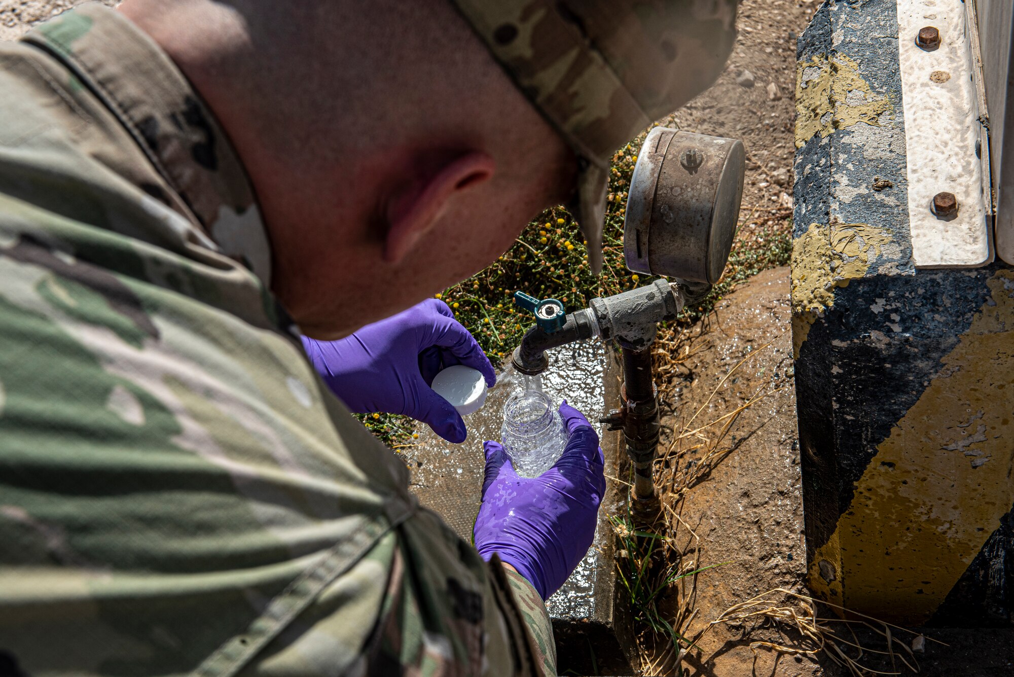 Senior Airman Matthew Ketterling, 379th Expeditionary Medical Operations Squadron bioenvironmental engineering journeyman, collects water samples to test for bacteria and chemicals June 16, 2021, at Al Udeid Air Base, Qatar.