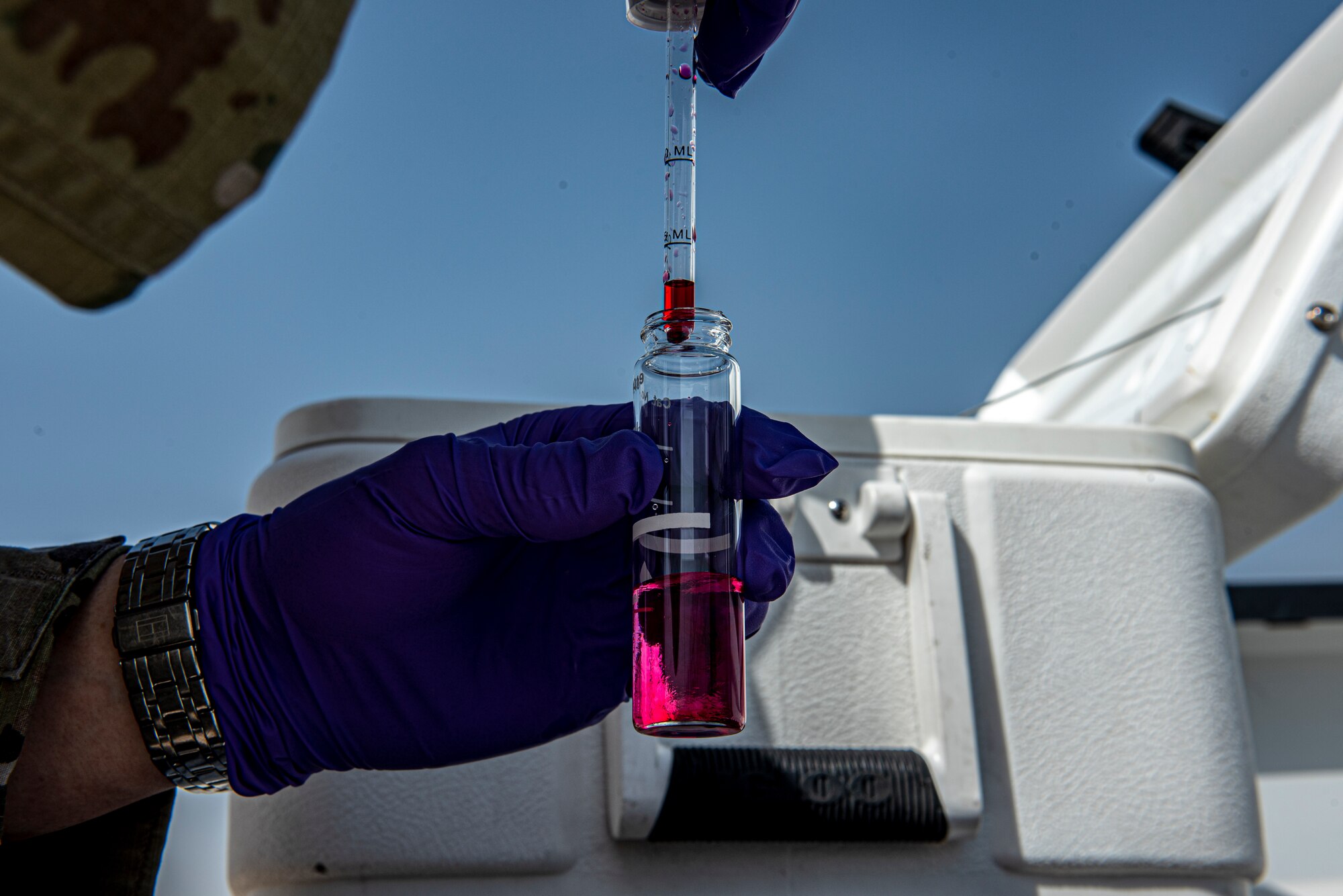 Senior Airman Matthew Ketterling, 379th Expeditionary Medical Operations Squadron bioenvironmental engineering journeyman, pours a Chlorine Reagent into a water sample June 16, 2021, at Al Udeid Air Base, Qatar.