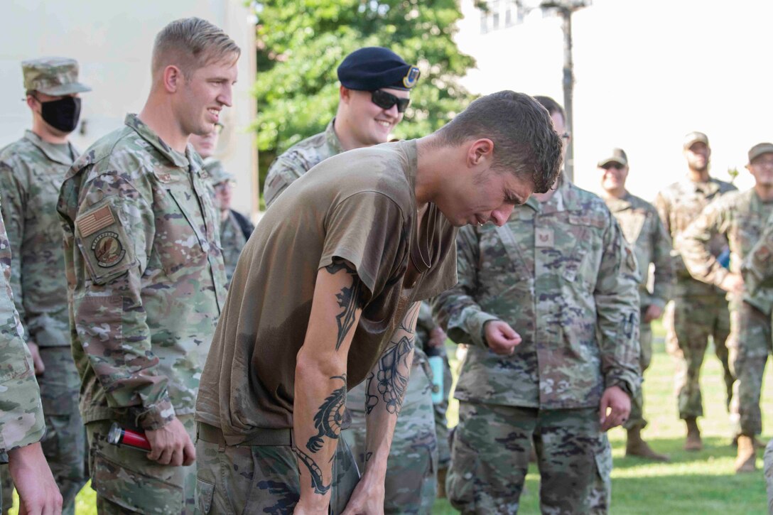 Senior Airman Dakota Blaylock, 374th Logistics Readiness Squadron combat mobility operations technician, recovers after oleoresin capsicum spray during a 374th Mission Support Group training day at Yokota Air Base, Japan, July 21, 2021.