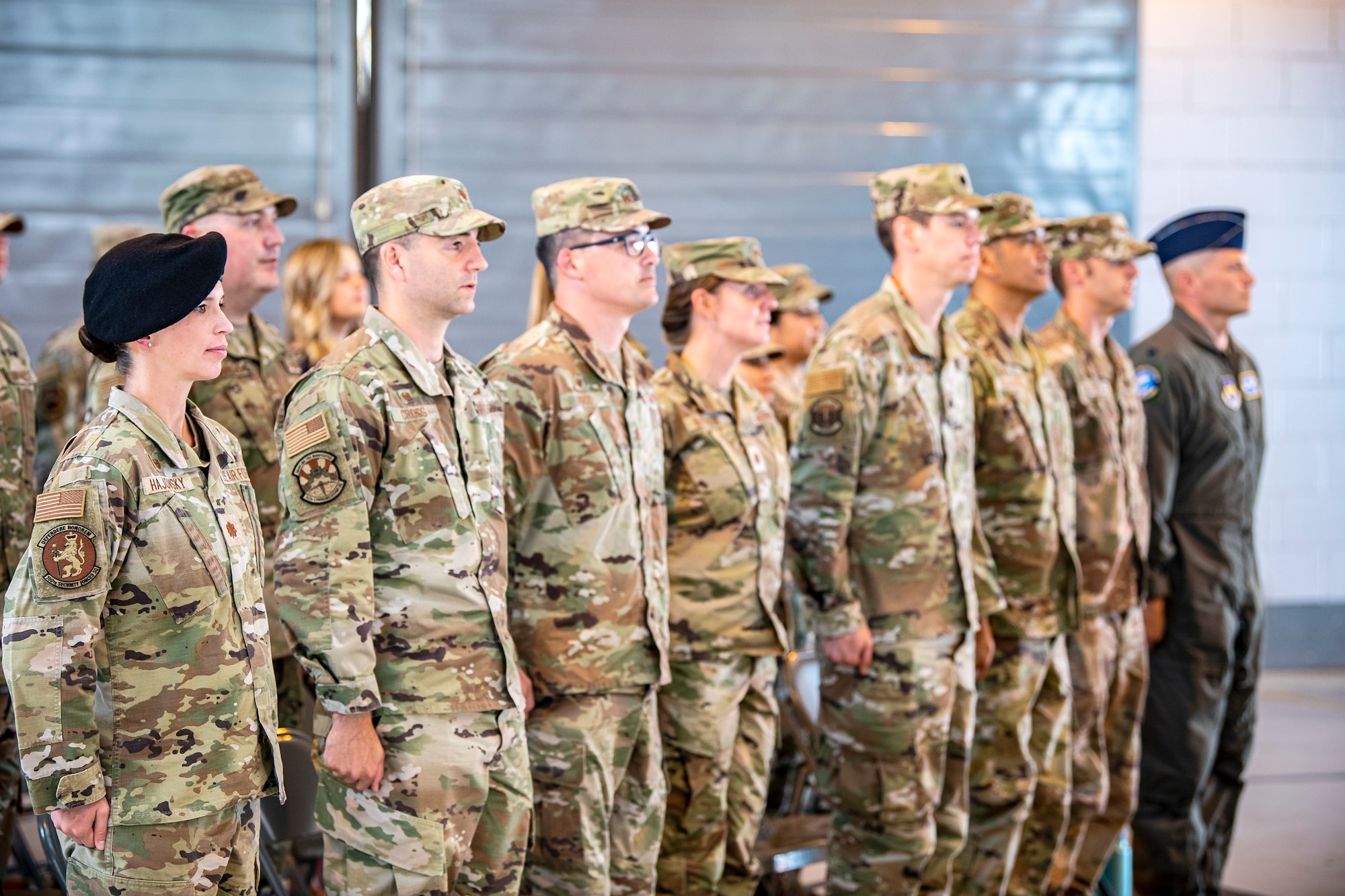 Airmen from the 501st Combat Support Wing stand at attention during a change of command ceremony at RAF Alconbury, England, July 20, 2021. The ceremony is a military tradition that represents a formal transfer of a unit’s authority and responsibility from one commander to another. (U.S. Air Force photo by Senior Airman Eugene Oliver)