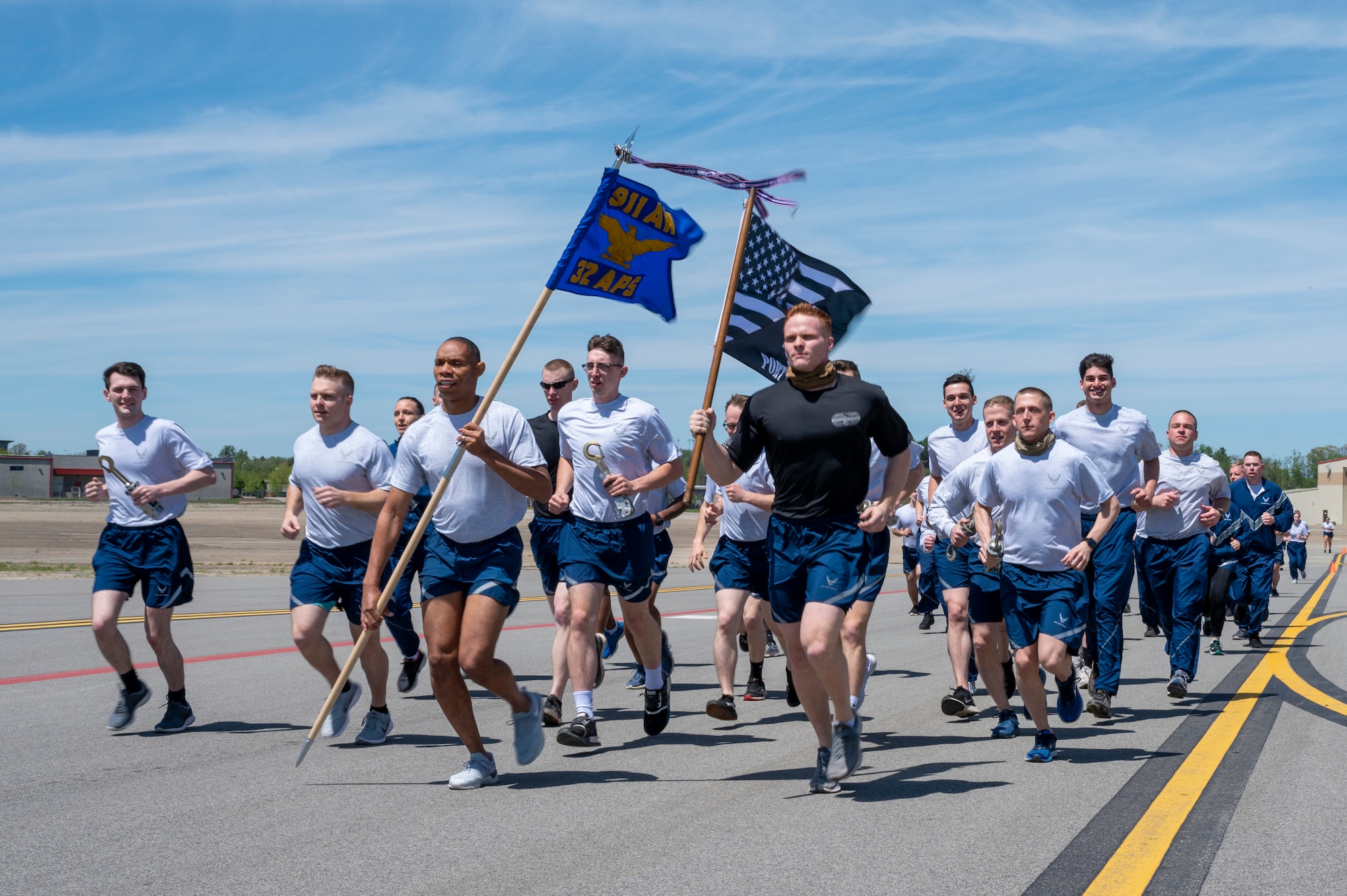 Airmen assigned to the 32nd Aerial Port Squadron run the annual Port Dawg Memorial Run on the flight line at the Pittsburgh International Airport Air Reserve Station, Pennsylvania, May 1, 2021. The PDMR is the way aerial port Airmen from around the Air Force pay respect to their fallen Airmen from the previous year.