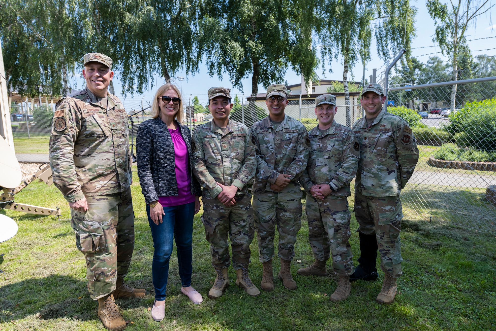 U.S. Air Force Airmen from the 52nd Communications Squadron take a photo with Lauren Knausenberger, U.S. Air Force chief information officer, following her visit at Spangdahlem Air Base, Germany, July 21, 2021. Knausenberger thanked the members of the 52nd CS for their diligent efforts in accelerating change in the cyber domain through Agile Combat Employment and Mission Defense Team. (U.S. Air Force photo by Senior Airman Ali Stewart)