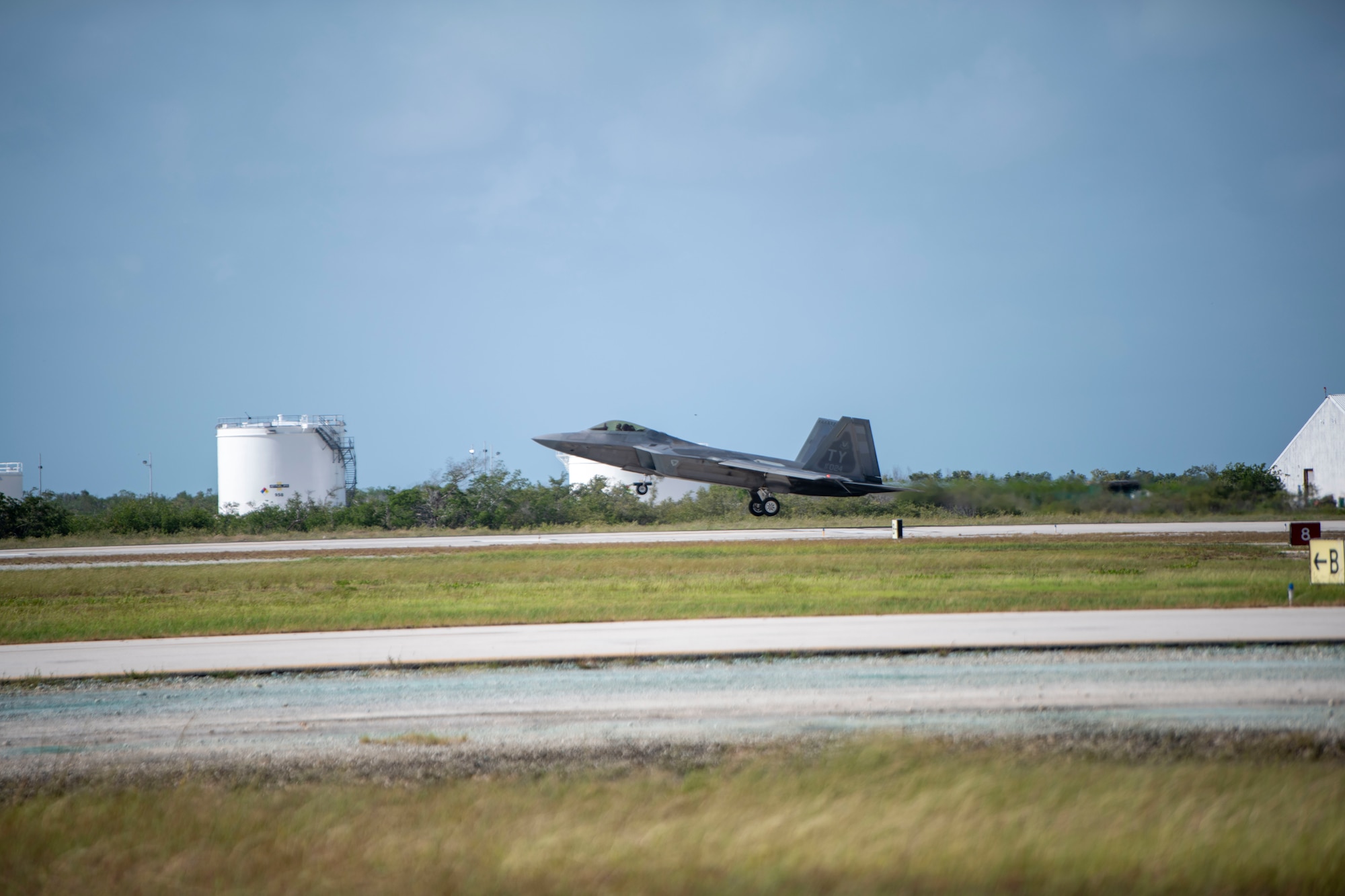 A U.S. Air Force F-22 Raptor lands on a runway.