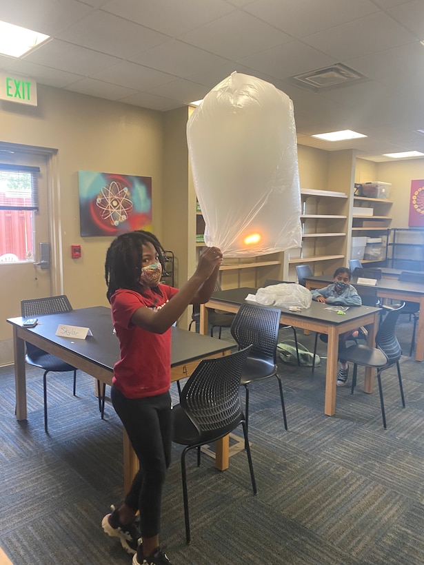 girls playing with lanterns