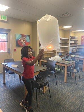 girls playing with lanterns