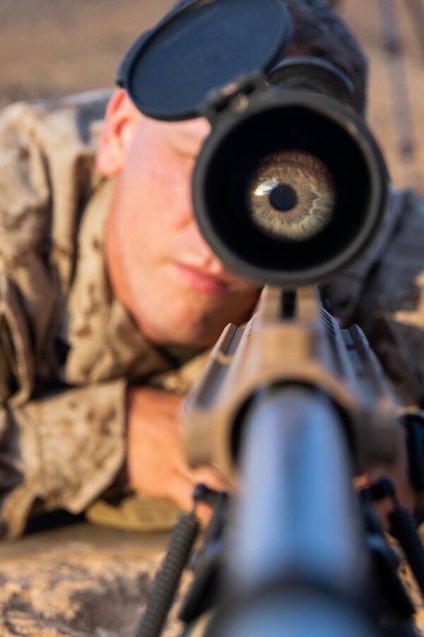 Cpl. Noah Enderle, a professionally instructed gunman with 3rd Battalion, 25th Marines, 4th Marine Division, eyes his target at range 205 during Integrated Training Exercise (ITX) 4-21 at Marine Corps Air Ground Combat Center Twentynine Palms, California on July 21, 2021. ITX is the culmination of Marine Forces Reserve units’ training cycle as they participate in a live-fire, combined arms exercise as a part of an integrated Marine Air Ground Task Force. (U.S. Marine Corps photo by Lance Cpl. David Intriago)