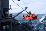MUTSU BAY (July 19, 2021)- Sailors aboard USS Warrior (MCM 10) deploy a Mine Neutralization Vehicle while conducting mine hunting operations during 2JA Mine Warfare Exercise (MIWEX) in Mutsu Bay, Japan. 2JA MIWEX is an annual bilateral exercise between the U.S. Navy and Japan Maritime Self-Defense Force to strengthen interoperability and increase proficiency in mine countermeasure operations