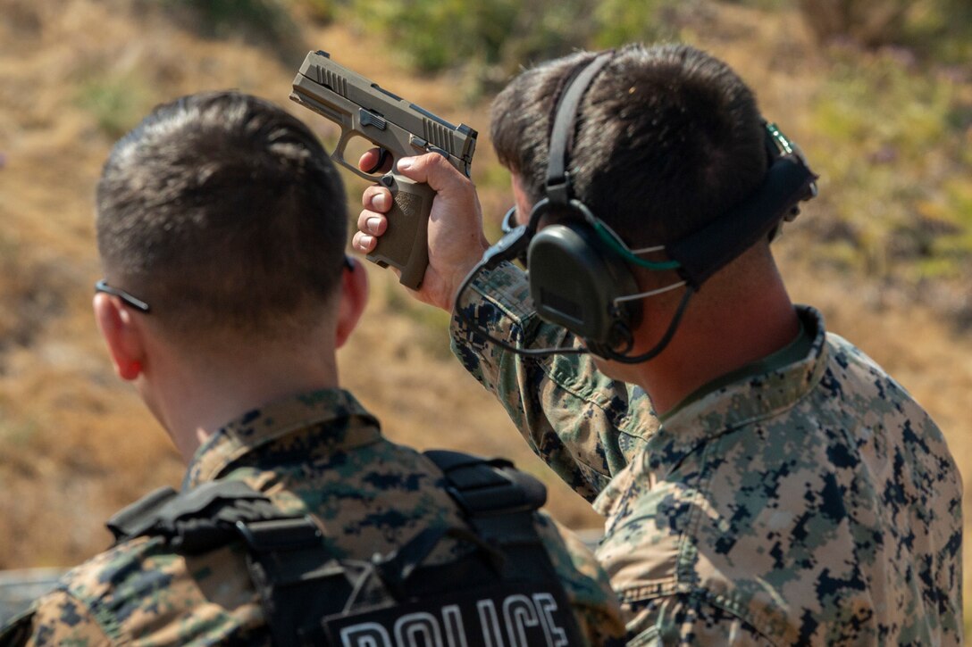 U.S. Marines with the Special Reaction Team, Provost Marshal’s Office, Marine Corps Air Station Miramar, conduct a live-fire training event held by the Marine Corps Shooting Team on MCAS Miramar, San Diego, California, July 15, 2021. SRT is a quick-reaction force responsible for responding to threats, such as active shooters, on Marine Corps installations. (U.S. Marine Corps photo by Sgt. Jorge A. Rosales)